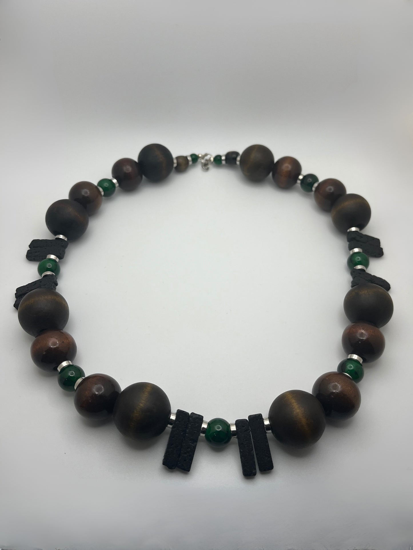 Black Lava, Emerald Glass, Wood Beads, Silver Accents